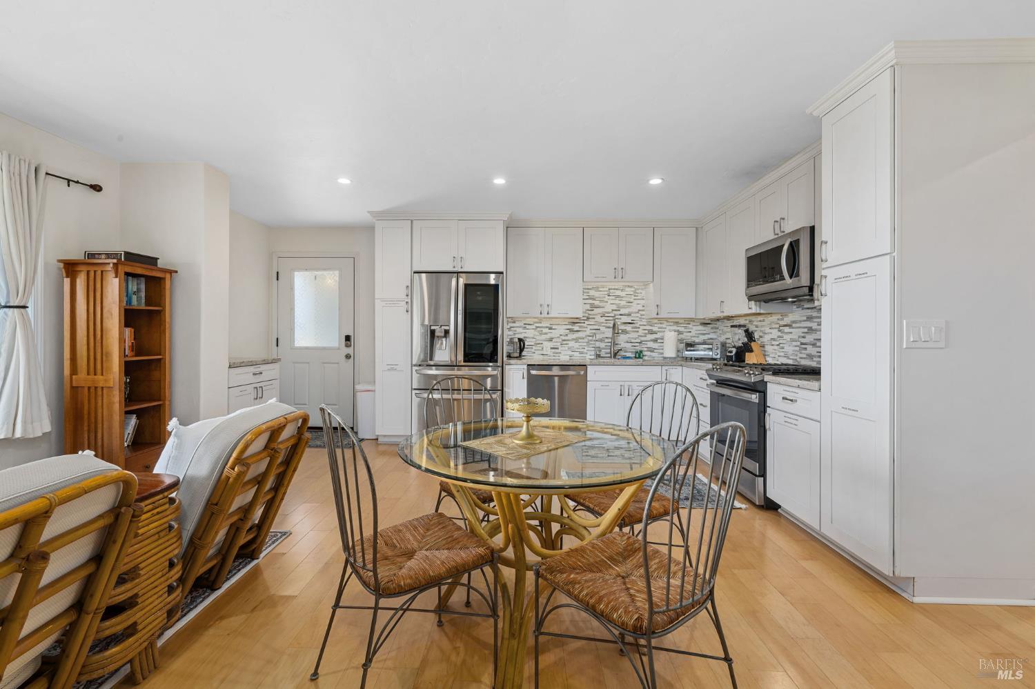 1846 Whaleship Road Bodega Bay, CA 94923 - Photo 45 of 69 a kitchen with stainless steel appliances kitchen island granite countertop a refrigerator and microwave