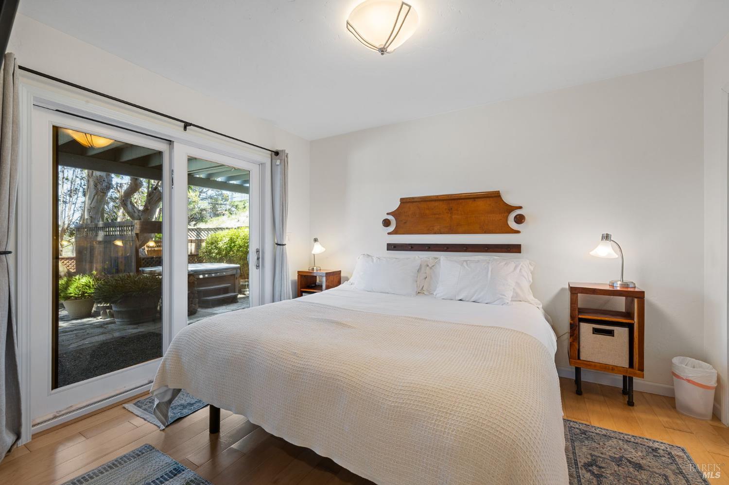 1846 Whaleship Road Bodega Bay, CA 94923 - Photo 47 of 69 a bedroom with a bed and a lamp next to a window