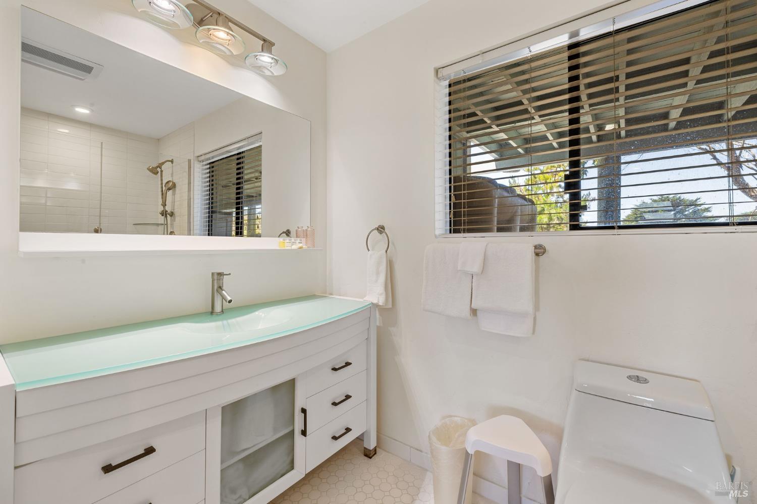 1846 Whaleship Road Bodega Bay, CA 94923 - Photo 48 of 69 a bathroom with a sink a vanity and a mirror