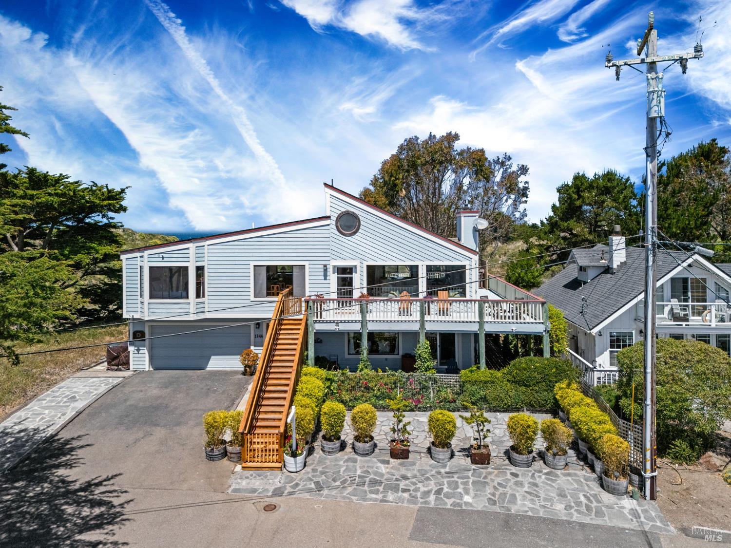 1846 Whaleship Road Bodega Bay, CA 94923 - Photo 5 of 69 a front view of a house with a yard