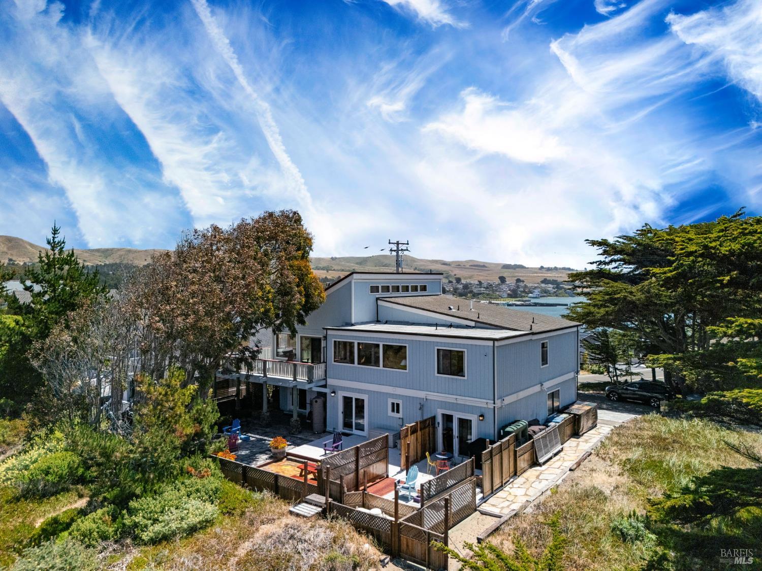 1846 Whaleship Road Bodega Bay, CA 94923 - Photo 10 of 69 a view of a big house with a big yard plants and large tree