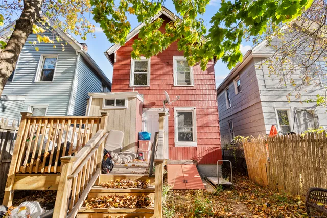 a view of a brick house with many windows