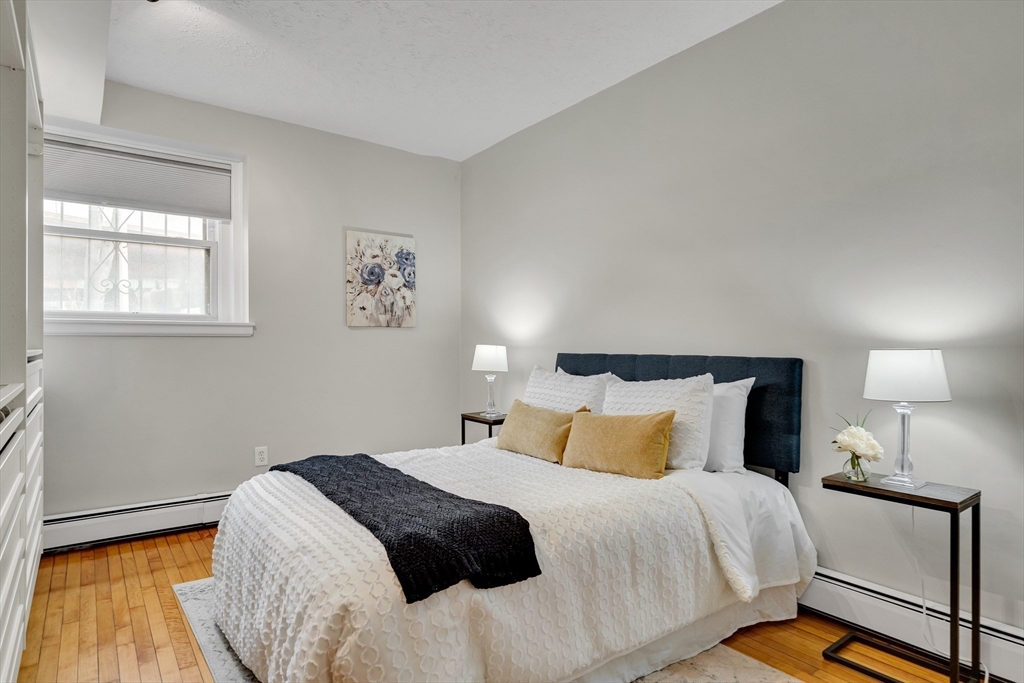 60 Charlesgate West, Unit BA Boston, MA 02215 - Photo 11 of 37 a bedroom with a bed and a night stand