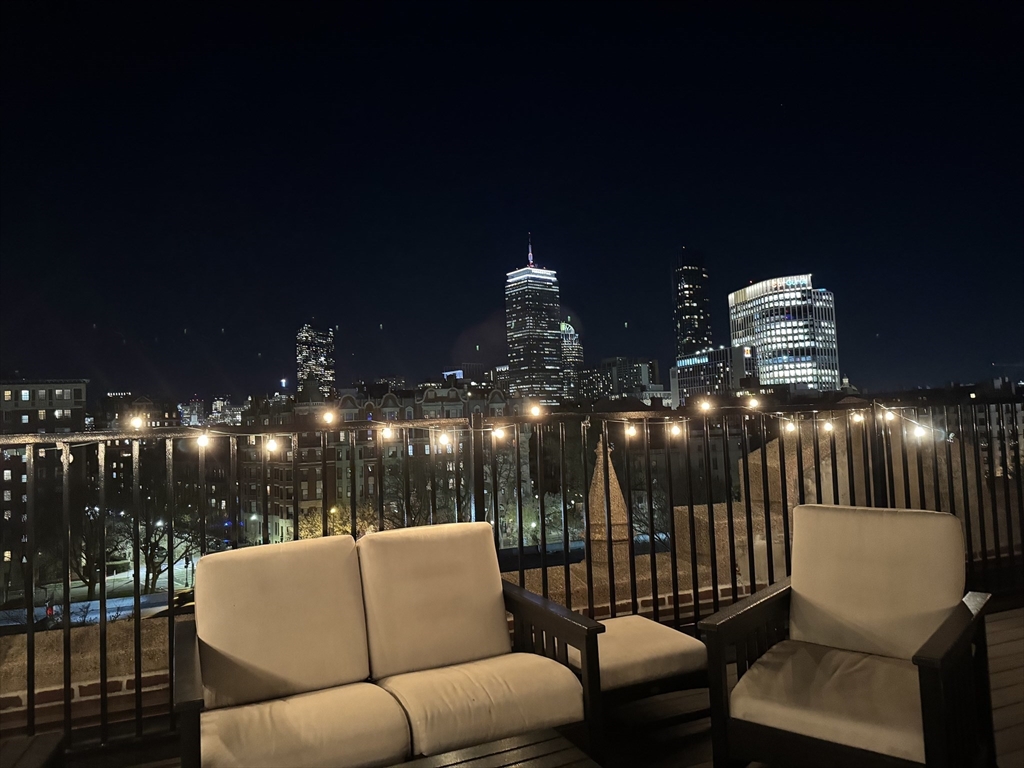 60 Charlesgate West, Unit BA Boston, MA 02215 - Photo 2 of 37 a outdoor living space with furniture and a floor to ceiling window