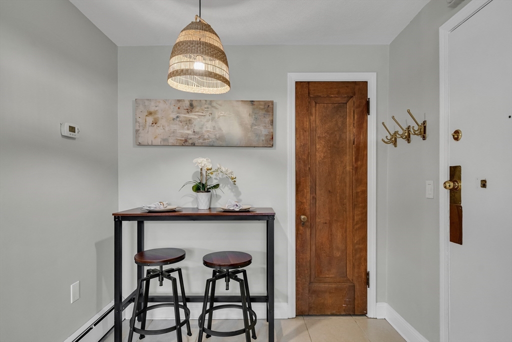 60 Charlesgate West, Unit BA Boston, MA 02215 - Photo 21 of 37 a table and chair in a room