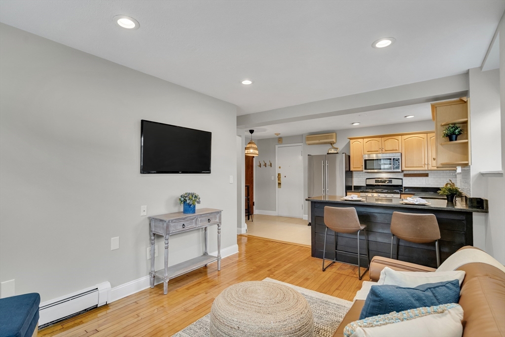 60 Charlesgate West, Unit BA Boston, MA 02215 - Photo 23 of 37 a living room with furniture and a flat screen tv