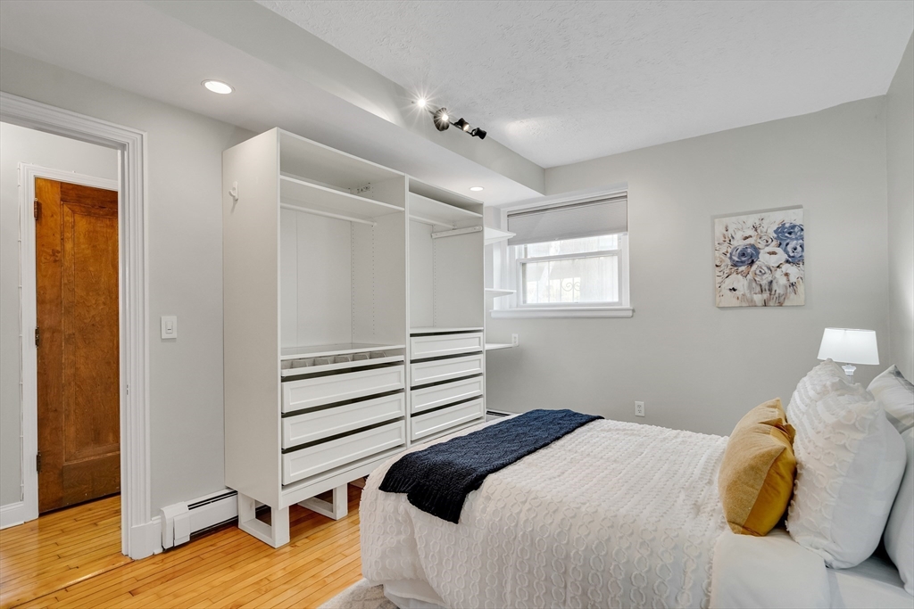 60 Charlesgate West, Unit BA Boston, MA 02215 - Photo 25 of 37 a bedroom with a bed and a window
