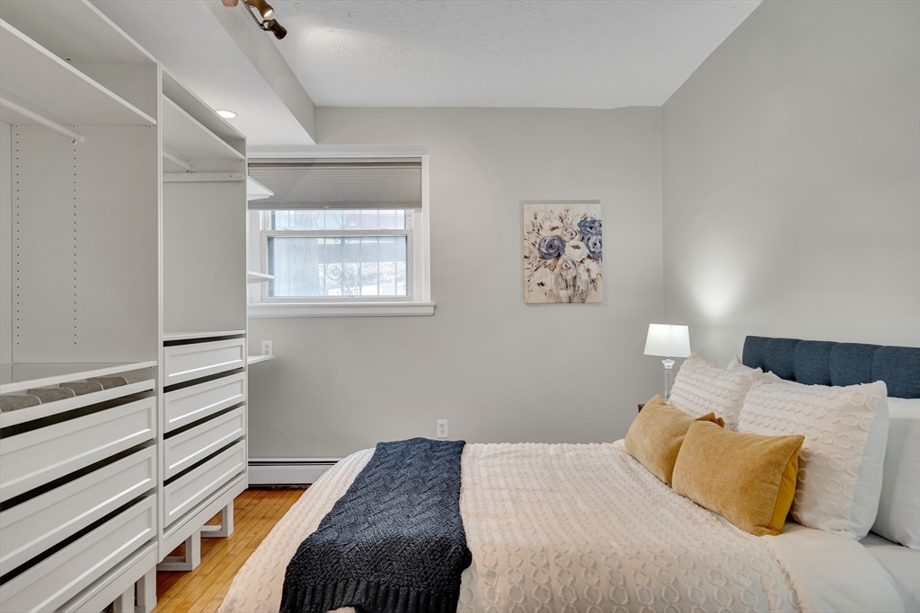 60 Charlesgate West, Unit BA Boston, MA 02215 - Photo 26 of 37 a bedroom with a bed and a window