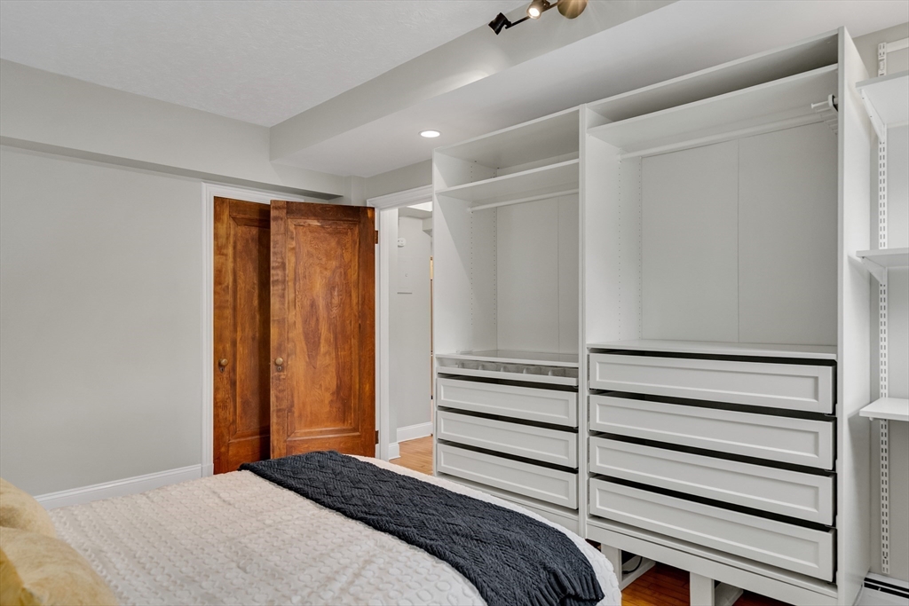 60 Charlesgate West, Unit BA Boston, MA 02215 - Photo 27 of 37 a bedroom with a bed and a window