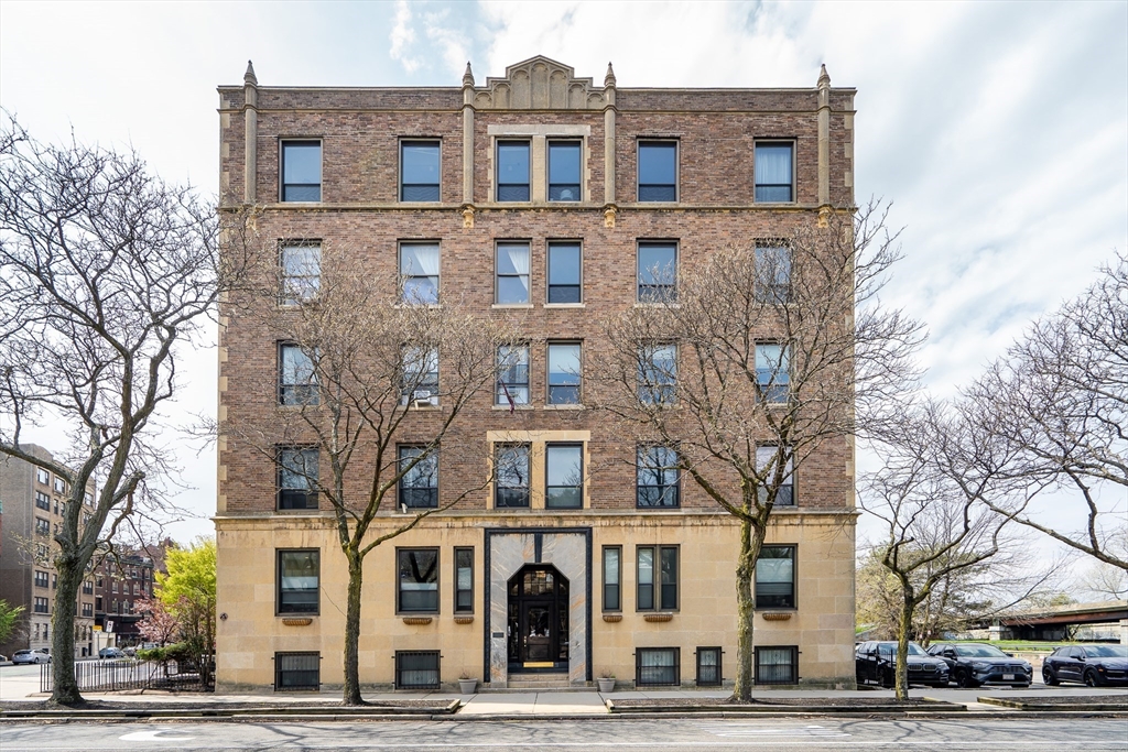 60 Charlesgate West, Unit BA Boston, MA 02215 - Photo 6 of 37 a front view of a building with lot of cars and trees