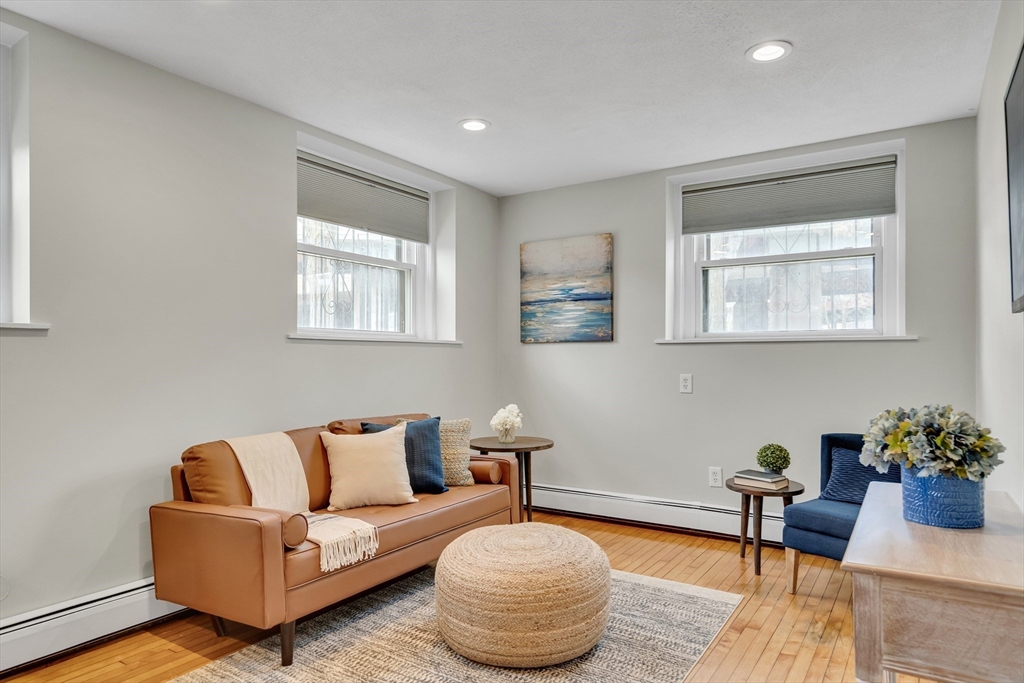 60 Charlesgate West, Unit BA Boston, MA 02215 - Photo 8 of 37 a living room with furniture and a potted plant