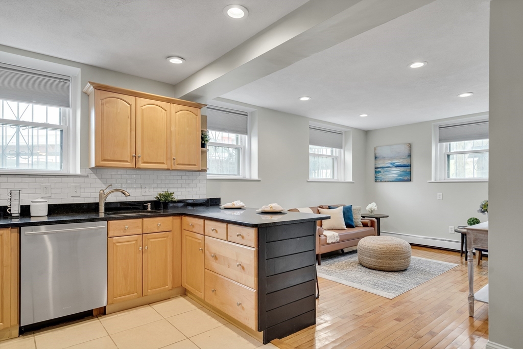 60 Charlesgate West, Unit BA Boston, MA 02215 - Photo 9 of 37 a kitchen with a sink window and cabinets