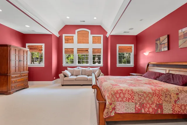 a bedroom with a bed and a couch