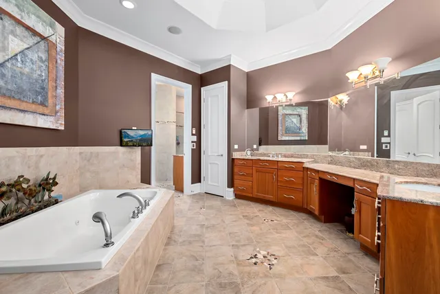 a large spacious bathroom with a granite countertop tub sink and mirror