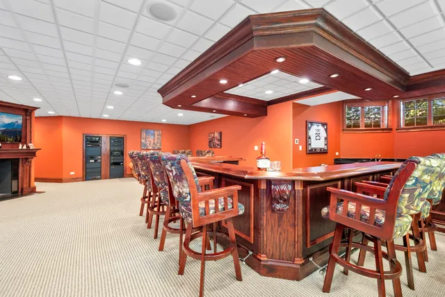 a view of a patio with table and chairs with wooden floor
