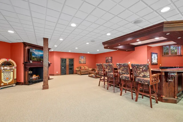 a view of a room with gym equipment and a large window