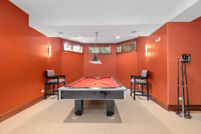 a room with furniture and air hockey table