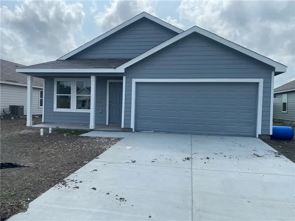 a front view of a house with garage