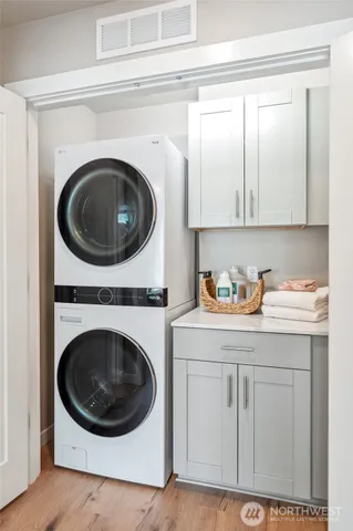 a utility room with sink dryer and washer