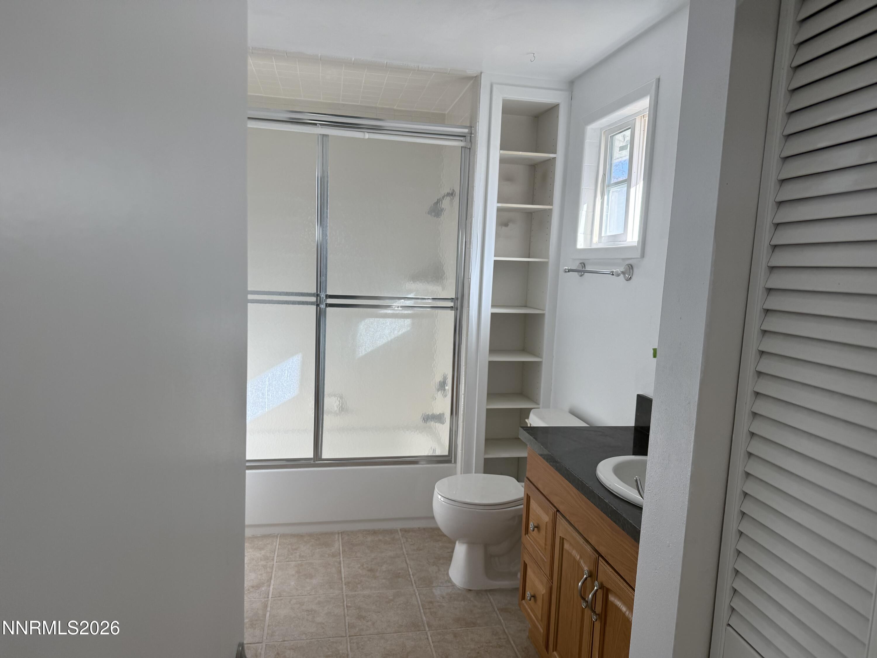 995 Sage View Drive Sparks, NV 89434 - Photo 6 of 13 a bathroom with a toilet and a shower