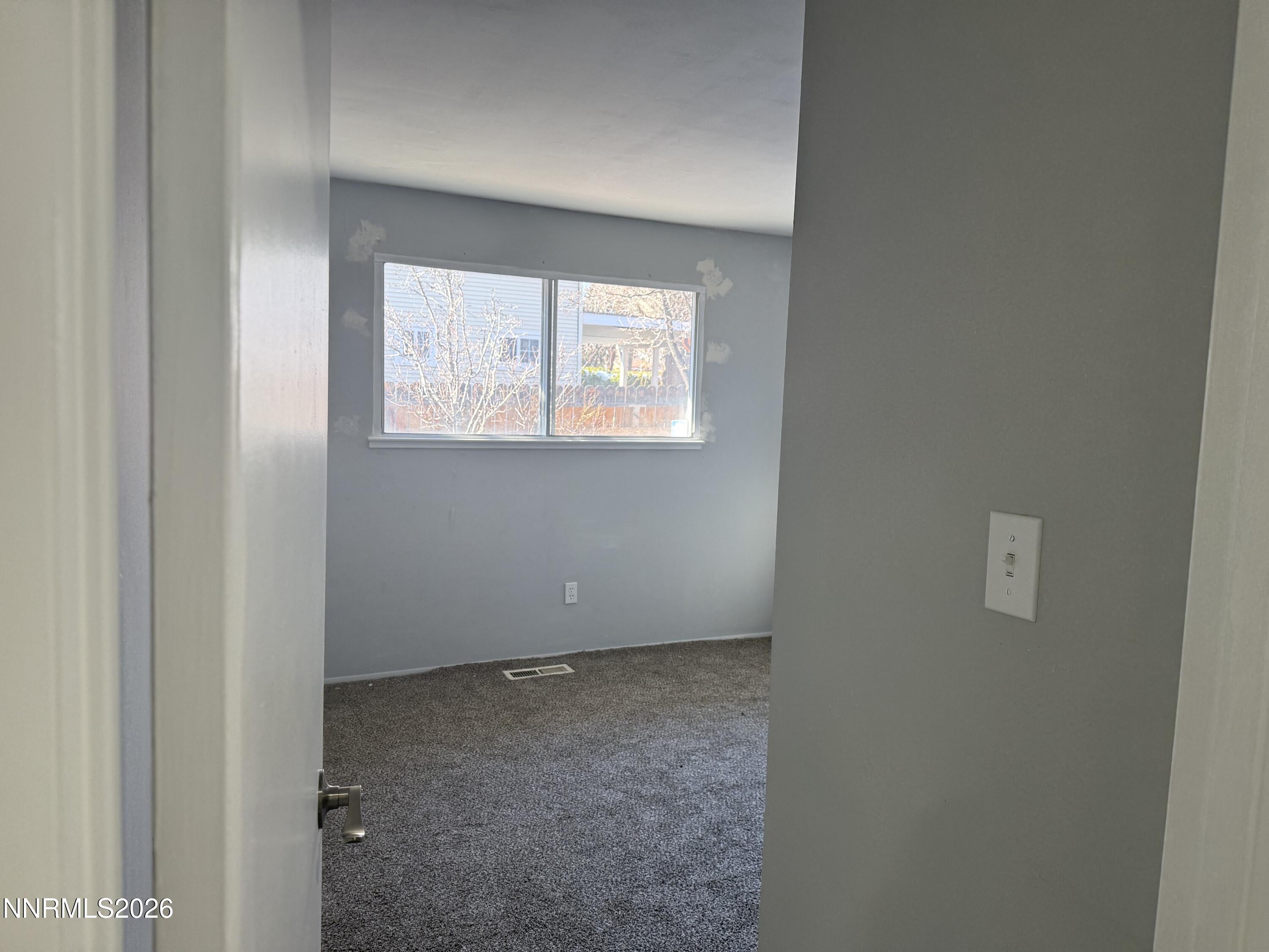 995 Sage View Drive Sparks, NV 89434 - Photo 8 of 13 a view of an empty room with a window