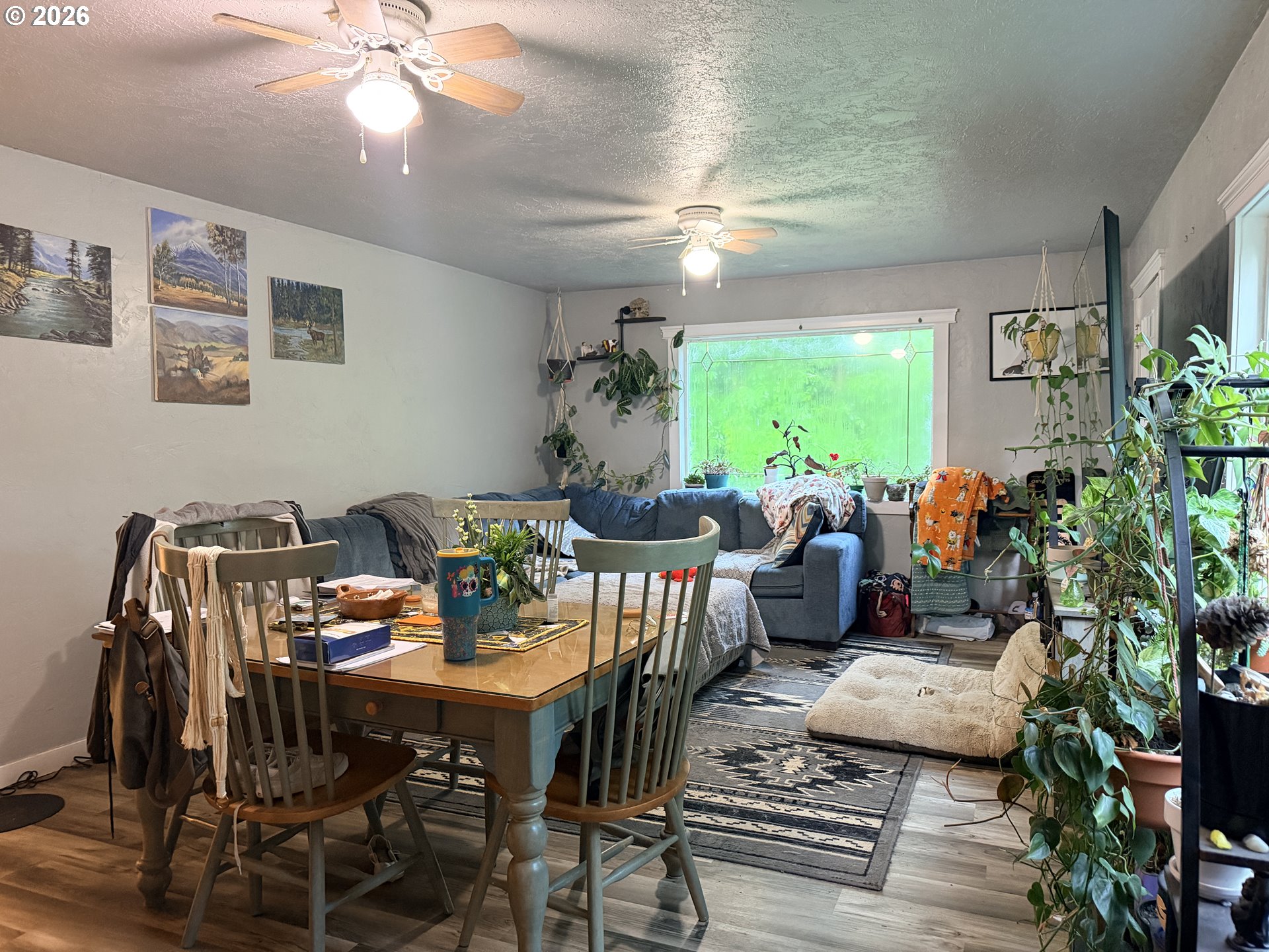 677 Southeast Moffitt Road Waldport, OR 97394 - Photo 21 of 36 a view of a dining room with furniture window and outside view