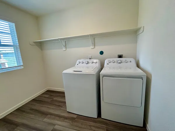 a utility room with dryer and washer