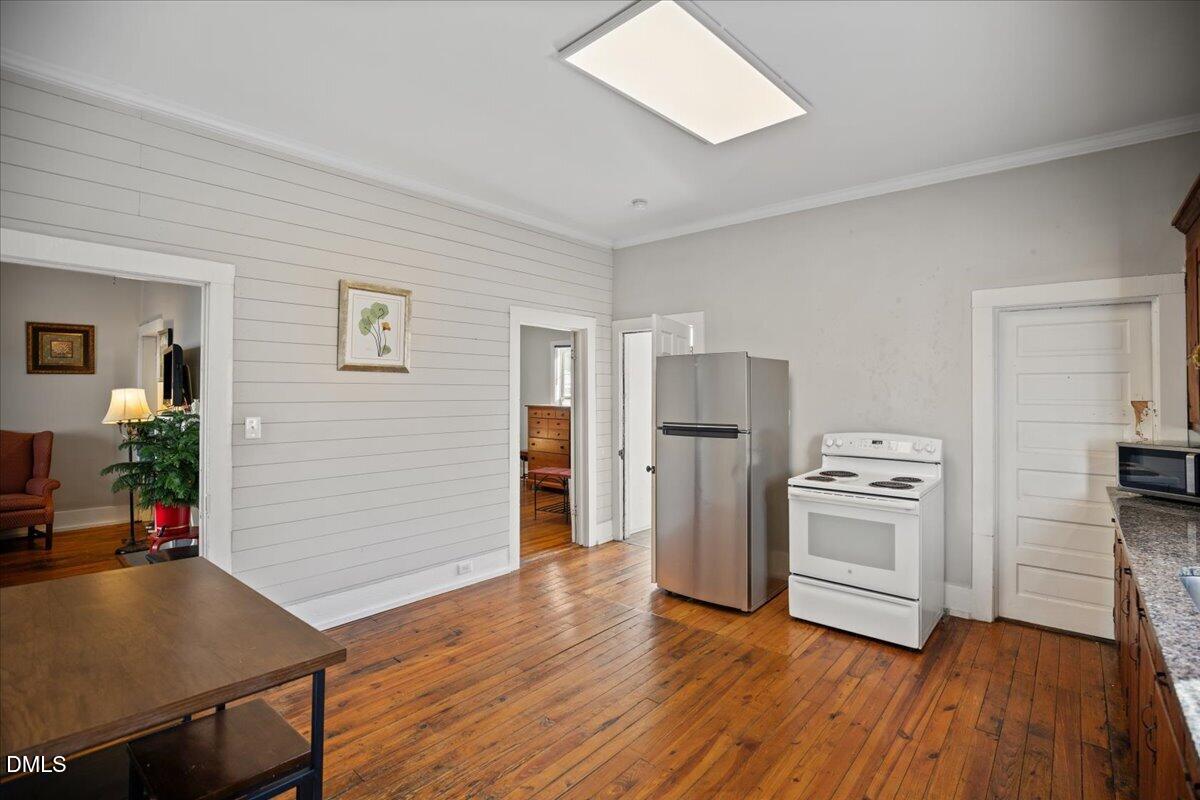 123 Kerr Drive Roxboro, NC 27573 - Photo 13 of 33 a kitchen with white cabinets and stainless steel appliances