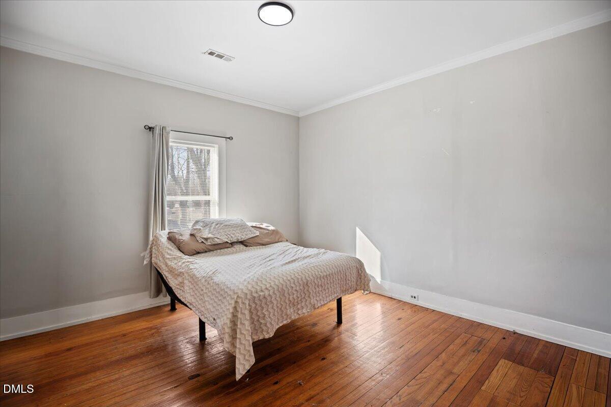 123 Kerr Drive Roxboro, NC 27573 - Photo 15 of 33 a bedroom with a bed and a window