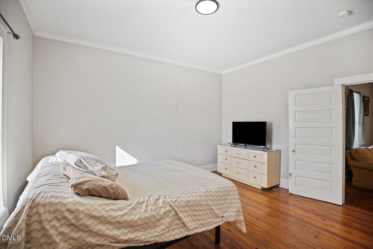 123 Kerr Drive Roxboro, NC 27573 - Photo 16 of 33 a bedroom with a bed and a flat screen tv