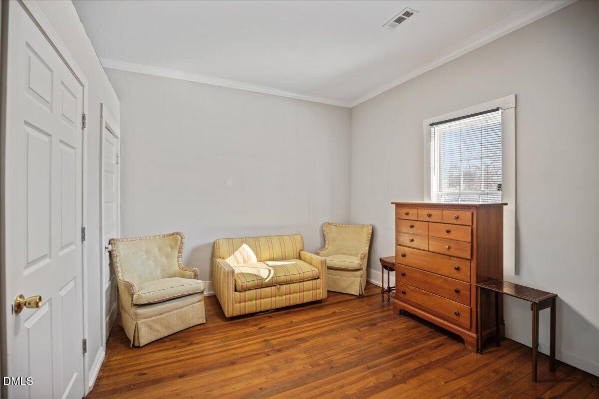 123 Kerr Drive Roxboro, NC 27573 - Photo 21 of 33 a living room with furniture and a wooden floor