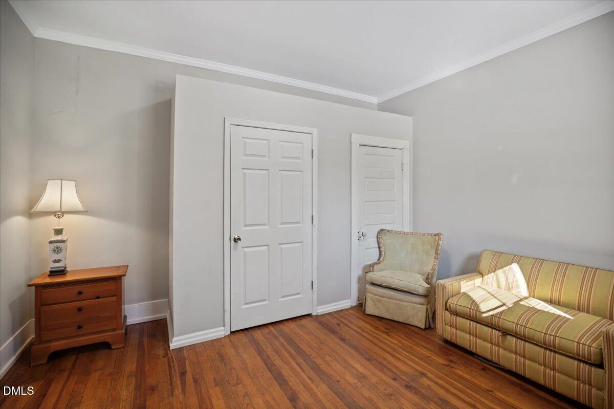 123 Kerr Drive Roxboro, NC 27573 - Photo 22 of 33 a bedroom with a bed and wooden floor