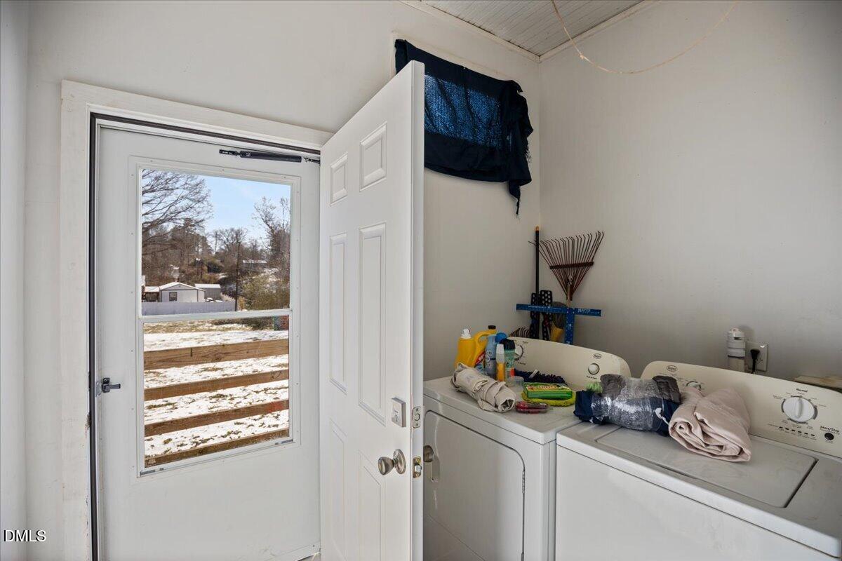 123 Kerr Drive Roxboro, NC 27573 - Photo 24 of 33 a room with a baby crib cabinets and a window