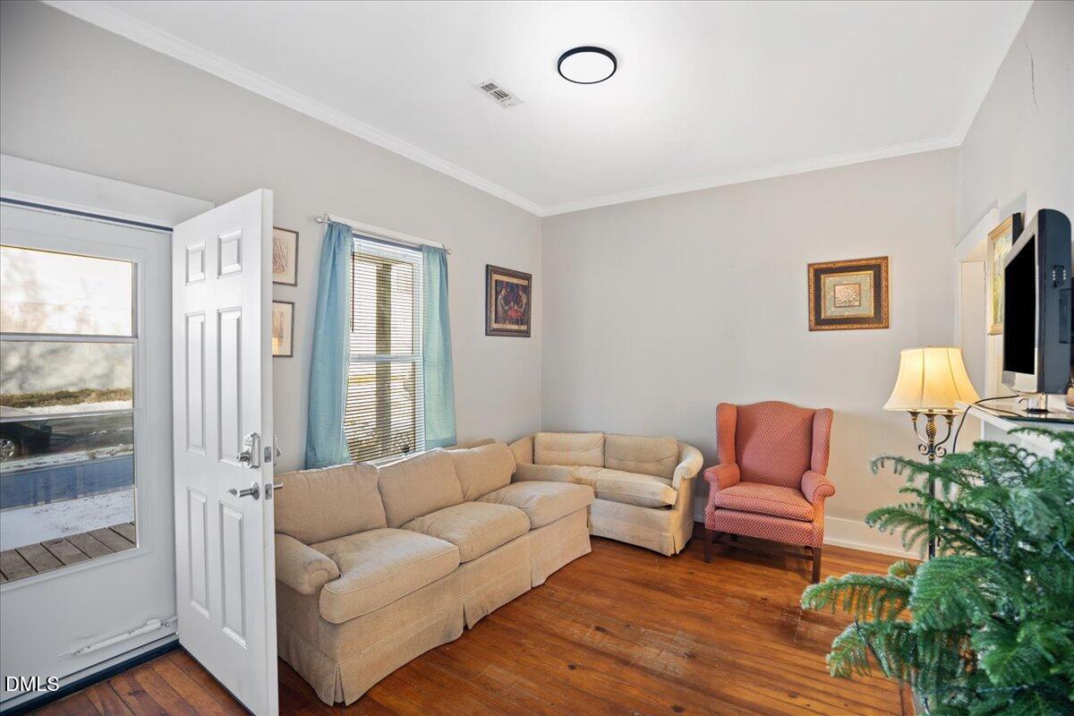 123 Kerr Drive Roxboro, NC 27573 - Photo 5 of 33 a living room with furniture and a flat screen tv