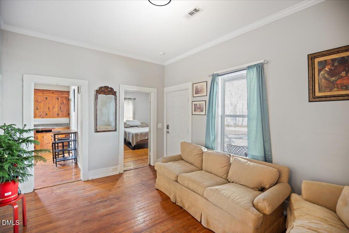 123 Kerr Drive Roxboro, NC 27573 - Photo 8 of 33 a living room with furniture and wooden floor