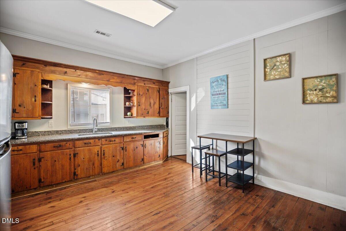 123 Kerr Drive Roxboro, NC 27573 - Photo 10 of 33 a kitchen with stainless steel appliances granite countertop a stove a sink and a refrigerator