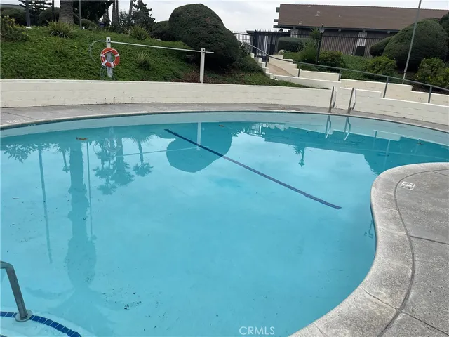 a view of swimming pool from a balcony