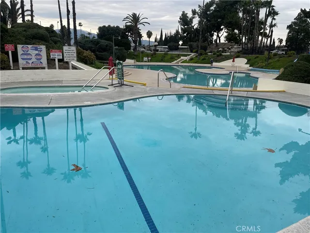 a view of a swimming pool with a patio
