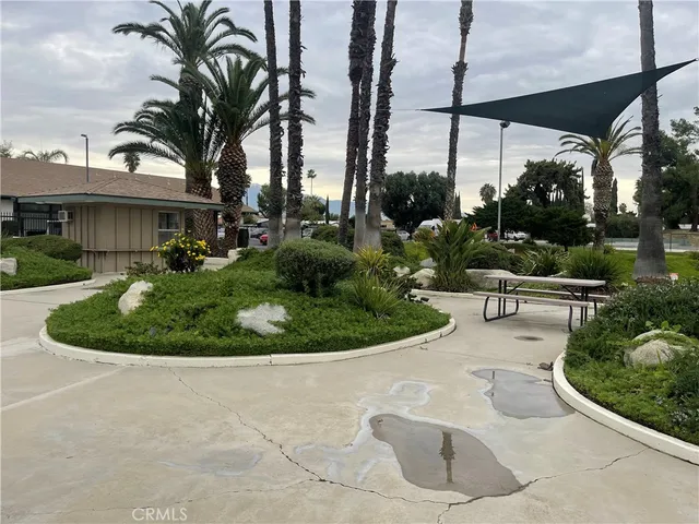 a view of a house with a backyard and porch