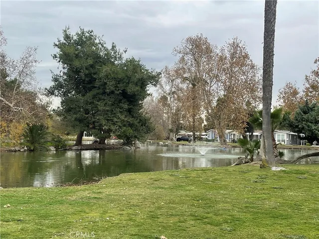 a view of a lake with houses with outdoor space