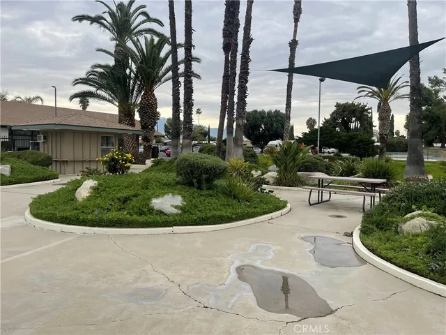 a view of a house with a backyard and porch