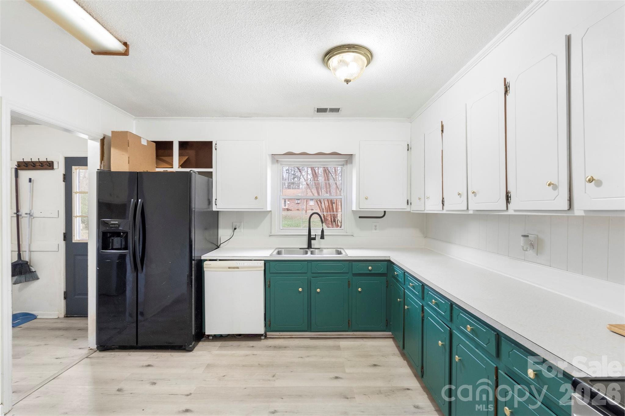 1152 Faulkner Road Clover, SC 29710 - Photo 13 of 39 a kitchen with a refrigerator and a sink