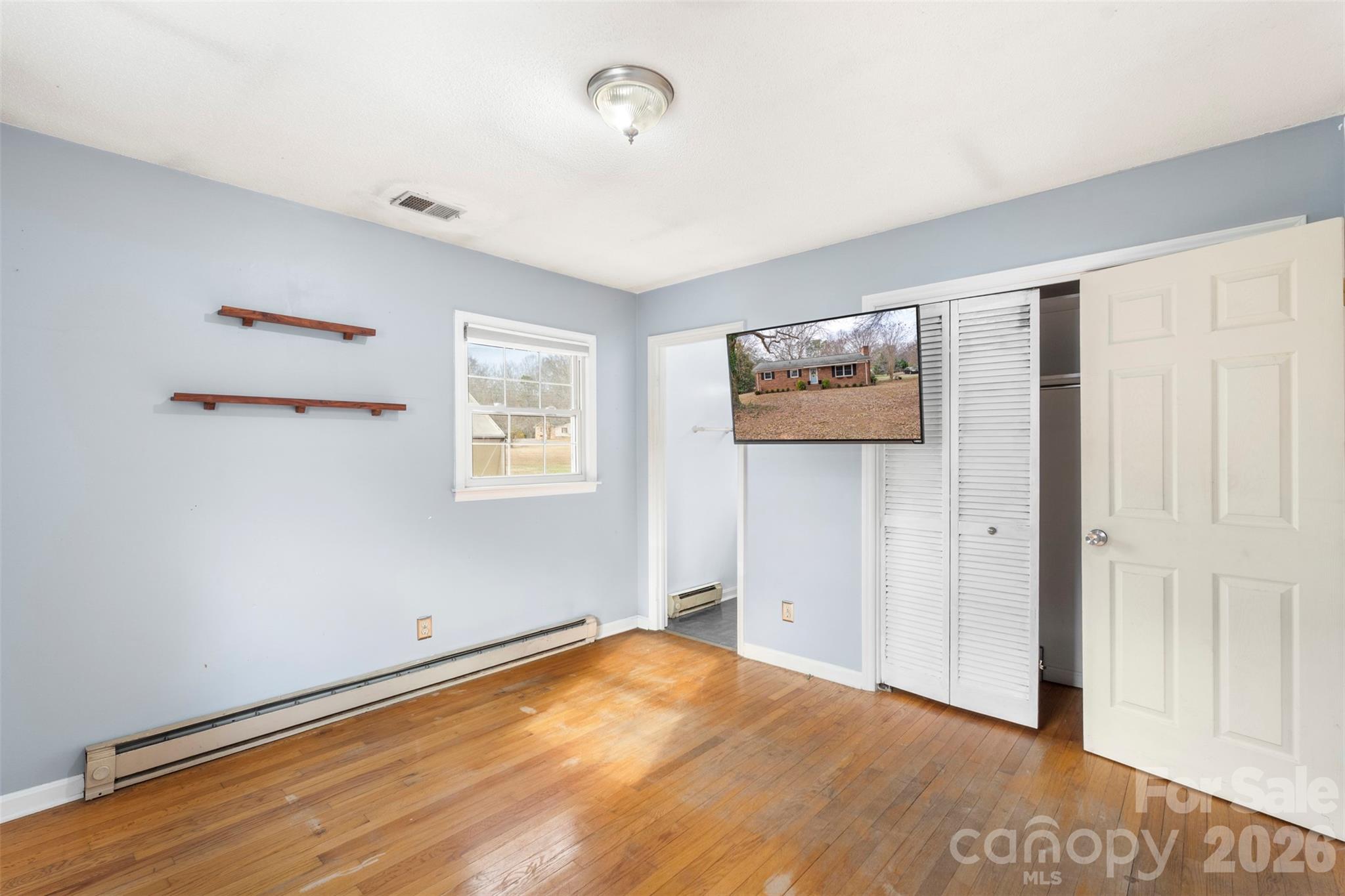 1152 Faulkner Road Clover, SC 29710 - Photo 17 of 39 a view of empty room with wooden floor