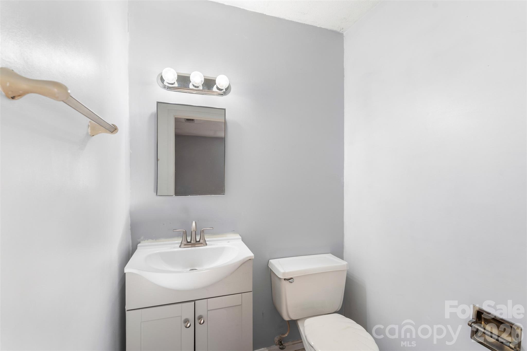 1152 Faulkner Road Clover, SC 29710 - Photo 19 of 39 a bathroom with a toilet sink and mirror
