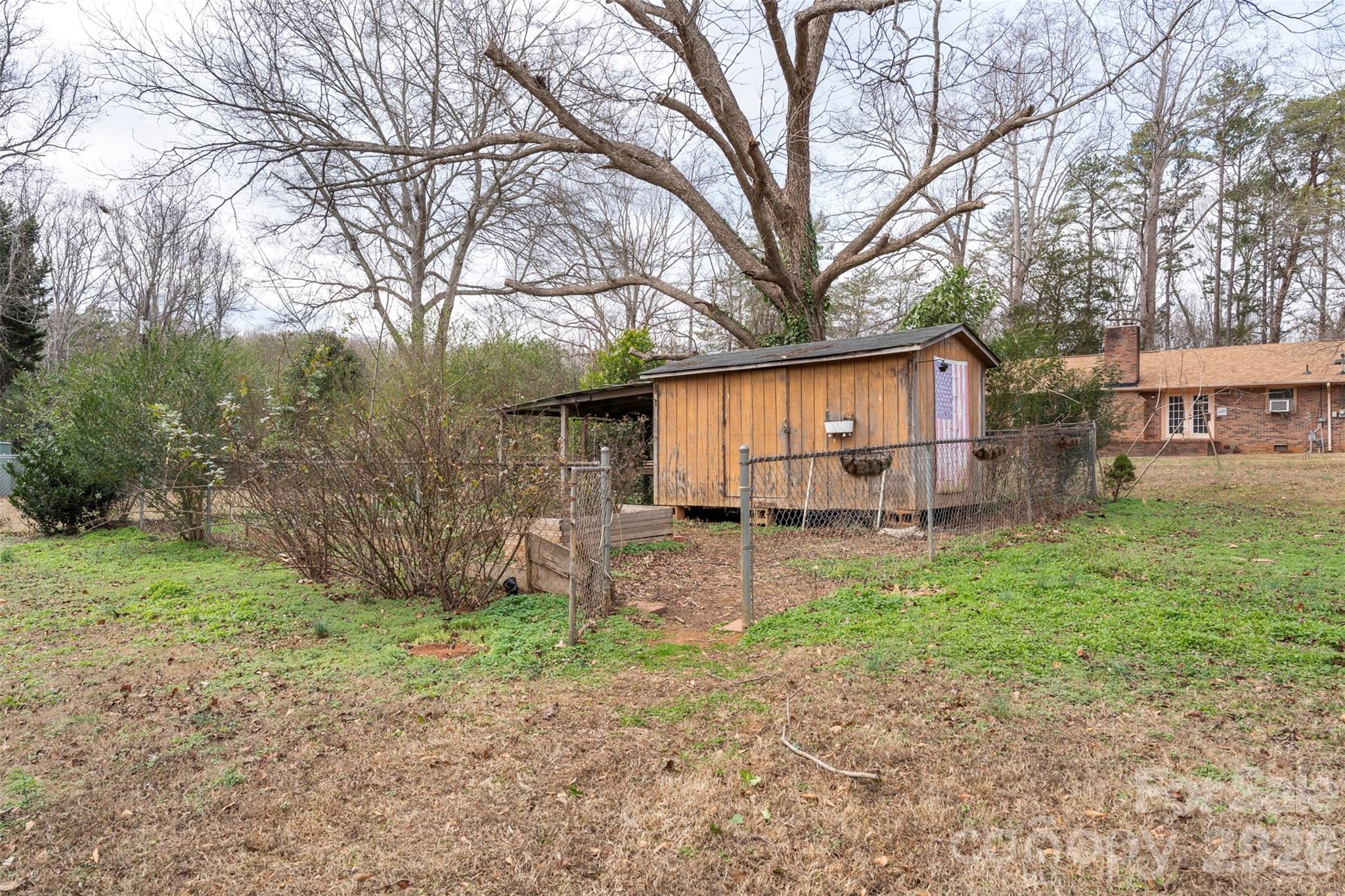 1152 Faulkner Road Clover, SC 29710 - Photo 30 of 39 a view of a house with a back yard