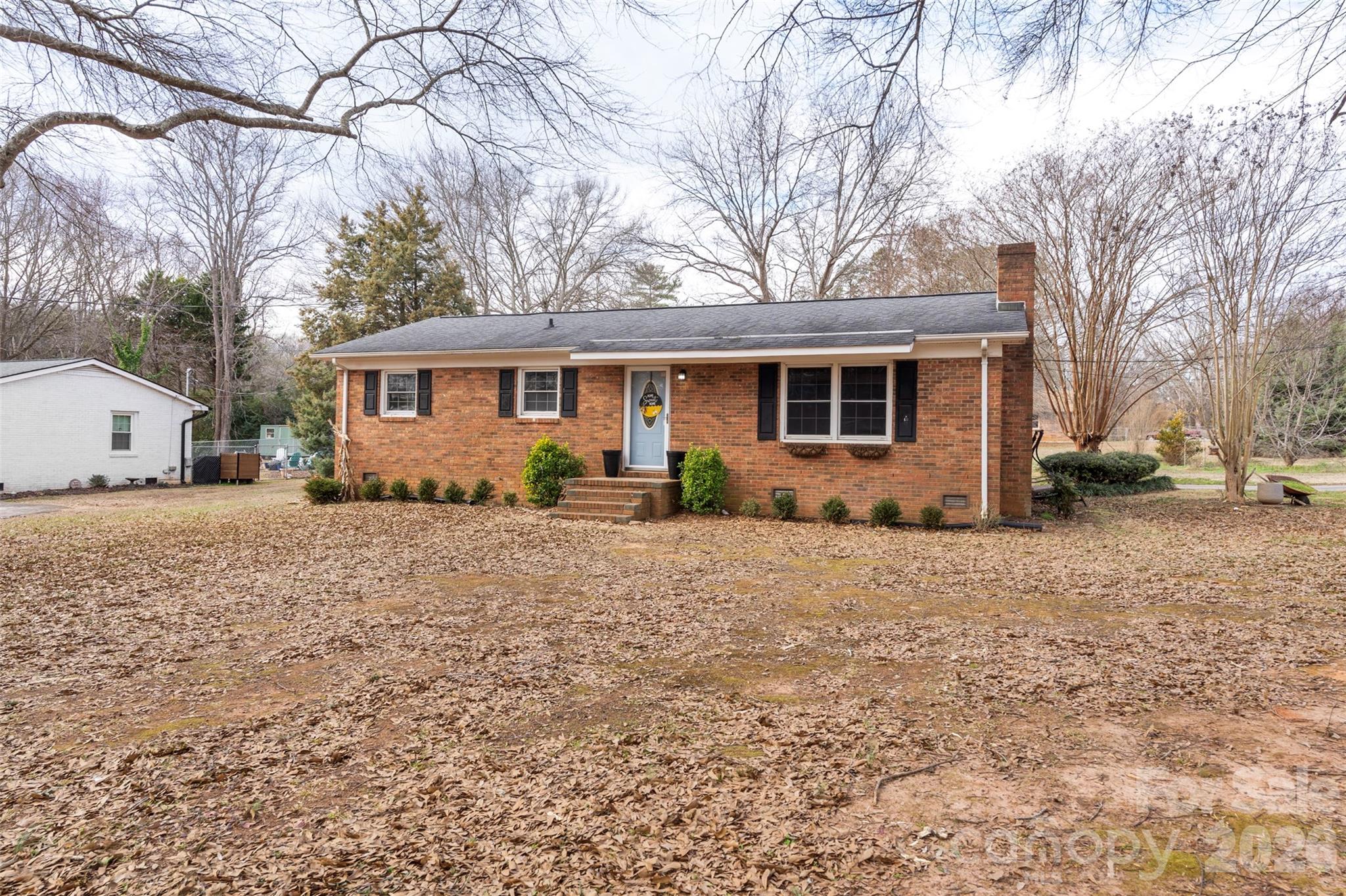 1152 Faulkner Road Clover, SC 29710 - Photo 4 of 39 a front view of house with yard and trees around