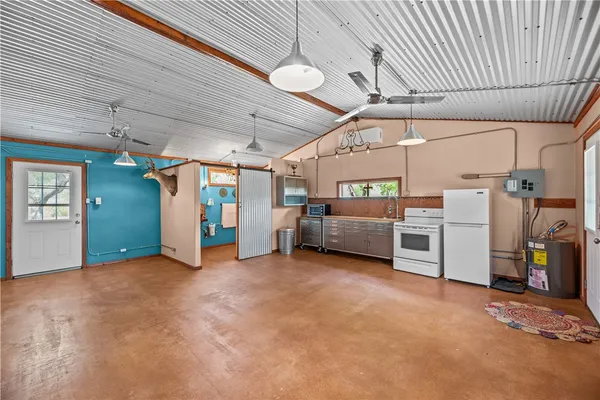 a bathroom with a toilet a sink and shower curtain