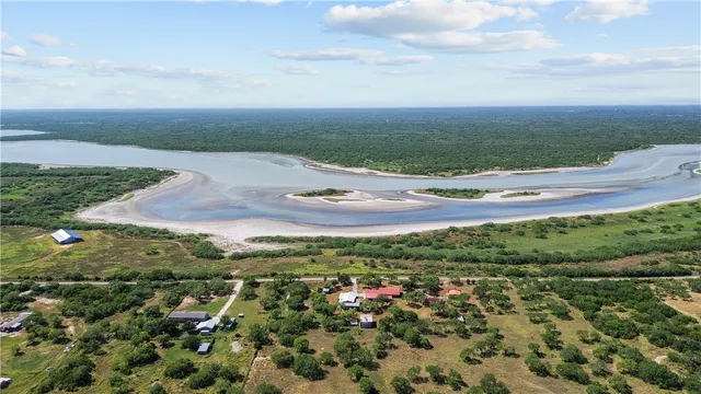 a view of a lake with green space