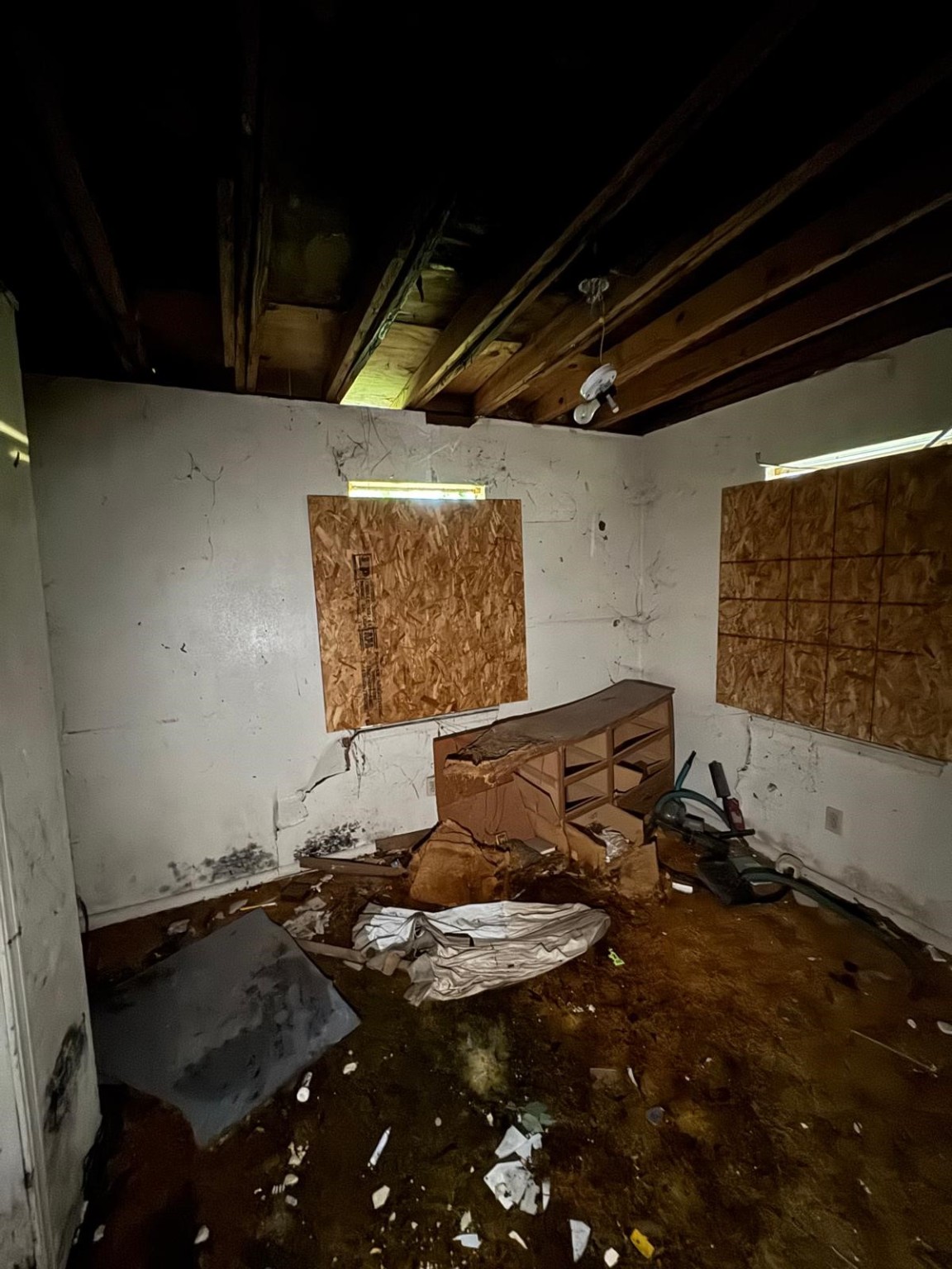 5118 Senior Street Houston, TX 77016 - Photo 7 of 9 a room with water heater and wooden floor