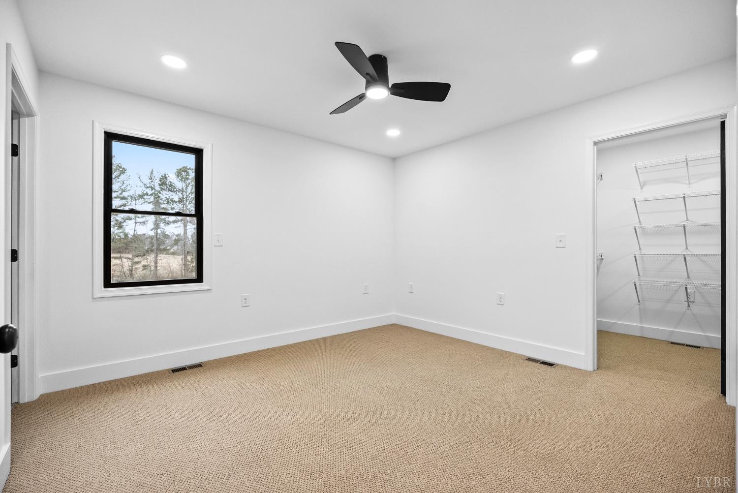 112 Savage Drive Rustburg, VA 24588 - Photo 20 of 51 an empty room with a ceiling fan and window
